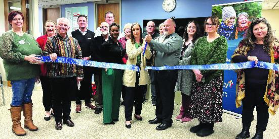 Mercy Hospital Logan County caregivers and community members cut the ribbon Friday on the new Senior Life Solutions program location.