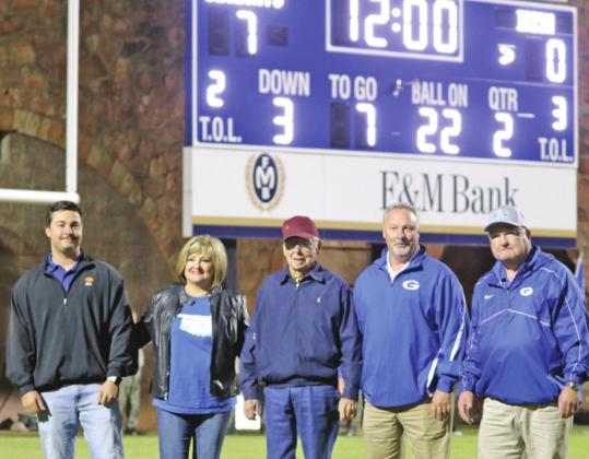 Pictured (L-R) Bryce Anderson, Wendy Anderson, John V Anderson, Barry Anderson and Dr. Mike Simpson under new Jelsma Stadium scoreboard.