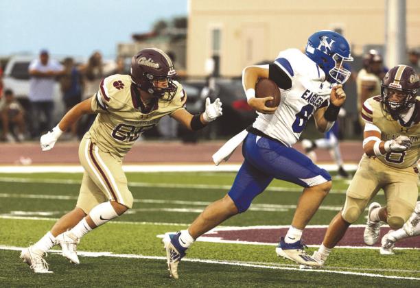 A pair of Cashon defenders chase a Hennessey running back during the Wildcats’ big win.