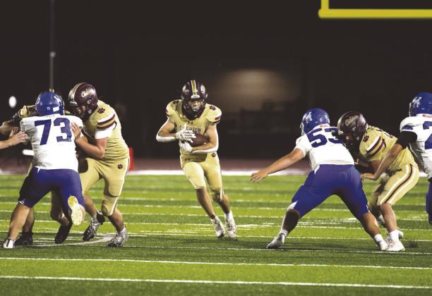 A Cashion player runs through a hole in the Hennessey defense during the Wildcats’ 41-13 win on Aug. 29.