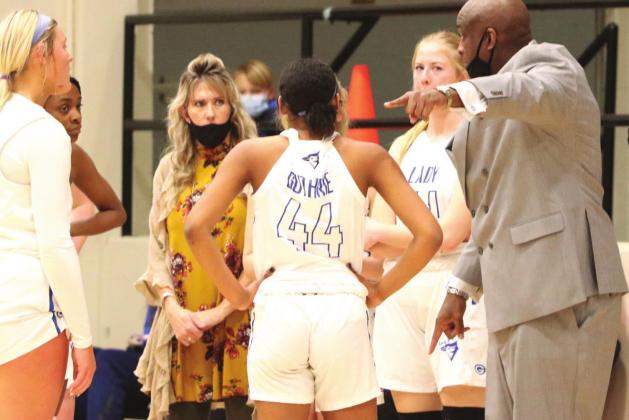 Above, Guthrie girls timeout Ponca City.