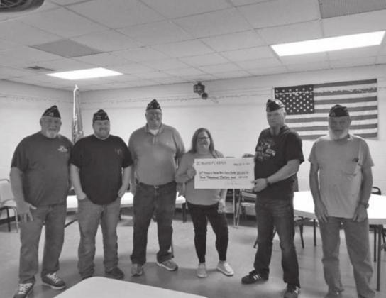 Jennifer Duncan representative from Nestle’ PURINA presenting a $4000.00 donation to the Guthrie VFW Post 4578 for needed building repairs and upgrades.
