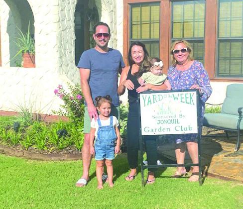 The Jonquil Garden Club has selected the home Austin and Desi Goodwin at 120 N. Drexel as the Yard of the Week. Pictured are Austin, Julia, Desi and Sabrina with Club Member, Kala Plagg.