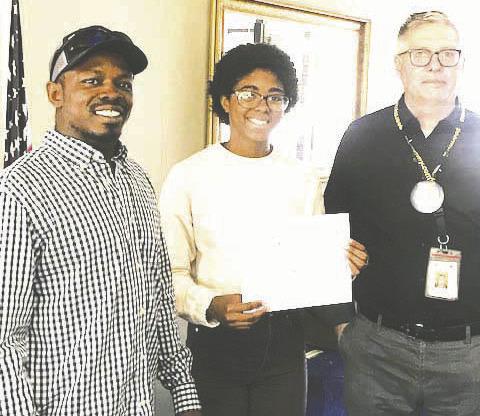 The Guthrie Rotary Club Student of the Week is Cheyenne Guymon. She is the daughter of Juanita Hayles. Cheyenne is active in Cross Country, Track &amp;amp; Field, National Honor Society, Academic Team, where she is the Captain. She is also a member of the Guthrie Public Library Teen Council. After graduation, Cheyenne plans to attend Southern Nazarene University on a track scholarship and will major in nursing. Pictured with Cheyenne is Rotary program speaker, Alfred Ratcliff and Rotary President, Terry Moore.