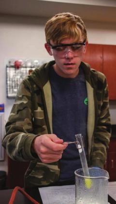 The Meridian Technology Center STEM Academy was named a Distinguished High School by Project Lead the Way (PLTW) for its Biomedical Sciences and Pre-Engineering programs. Pre-Engineering student Gideon Heil conducts an experiment in the lab.