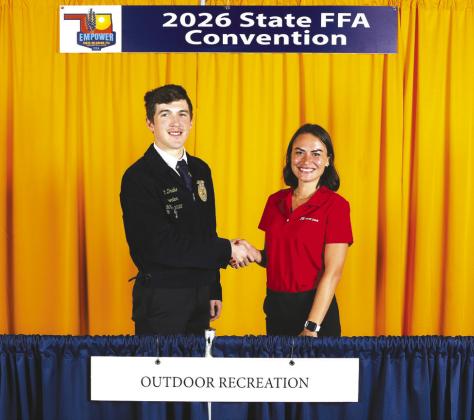 Lauren Partain (right), public affairs manager for John Zink, congratulates Britton Drake of the Guthrie FFA Chapter, who placed second in the 2026 Oklahoma FFA Outdoor Recreation State Proficiency Award area. Kaden Atwood (not pictured) of the Eufaula FFA Chapter captured first-place honors, and Colten Scroggins (not pictured) of the Mulhall-Orlando FFA Chapter placed third. Photo courtesy Oklahoma FFA Association.