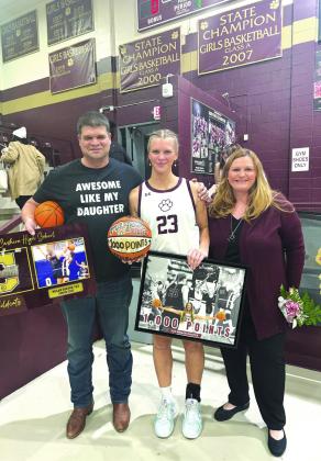 Cashion's Megan Shafer with her family during her 1000 point record hitting game Courtesy of Kim Shafer.