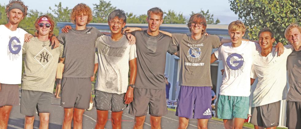 GHS Mile Night Boys team with Coach Bryce Balenseifen after race.