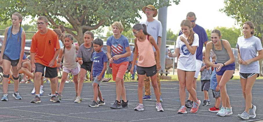 Start line of open 800 meter race for kids and adults.