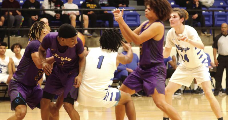 Nate Borland and Corbin Witt fight for control of ball with multiple Northwest Classen players.