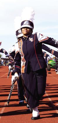 Members of the Marching Pride Band perform during the Funk Train during the third quarter of the Lions Football game.