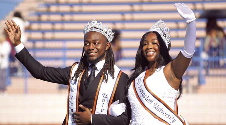 Mister and Miss Langston University wave to the crowd during half-time of the Langston University Homecoming football game.