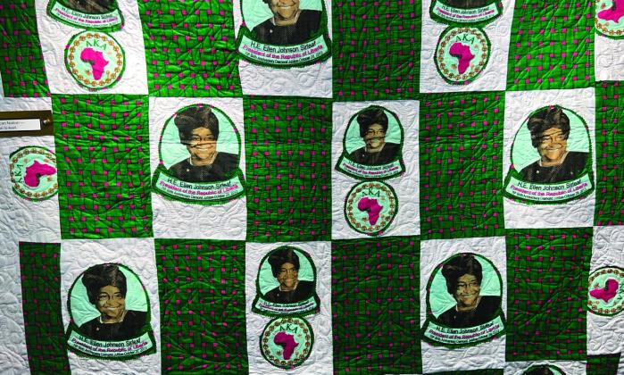 Titled #8220;_st Woman President f n African Nation,” this artwork is based on resident Ellen Johnson Sirleaf of Liberia.