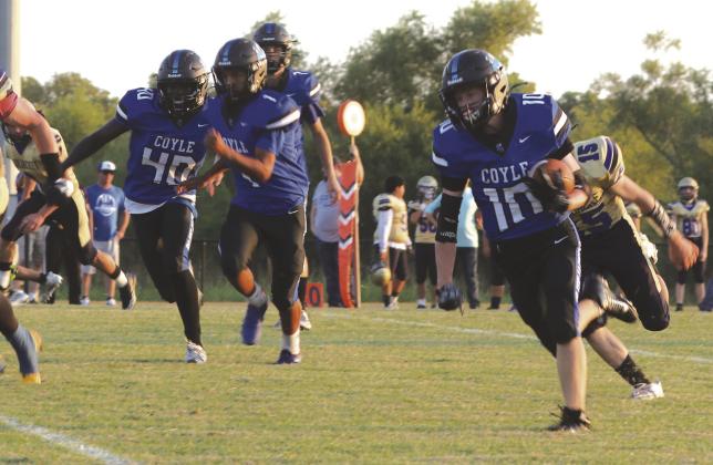 Coyle's Carson Hock on the way to one of his five touchdowns on September 13.