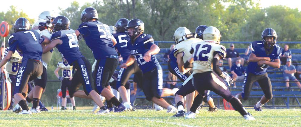 Coyle Offensive line on the move.