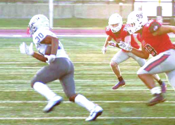 Guthrie’s Isaiah Hammons turns the corner on one of his runs in Ponca City last week. Photo courtesy of Ponca City News.