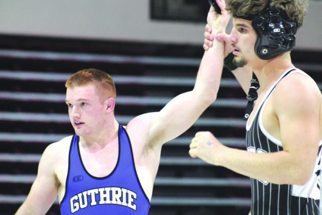 Guthrie's Bryson Hall wins the 175-pound match over McAlester to give the Bluejays the win. Saturday, Feb. 15. Photos by George McCormick.