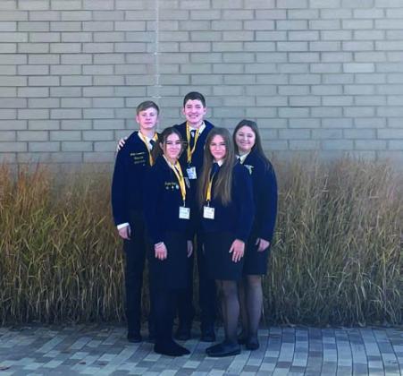 M-O FFA chapter officers pose alongside Jeremy Schmidt and his Honorary American FFA Degree.