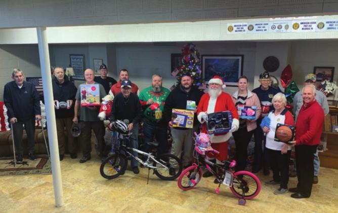Greg Price (Adjutant), Larry Woods, Bob White, Steve Bowers, Charlie Downs, Jim Fry, Michael Manning (Sergeant of Arms), Patricia Mutters, Billy Weeks, Ryan Friesen, Ron Powell, Jerry Beranek and Mayor Steve Gentling at the American Legion Toy Drive.