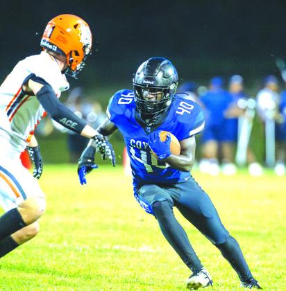 Coyle running back Elijah Sims (#40) cuts up field against Yale on Sept. 5. Sims ran for 126 yards and two touchdowns, and teammate Carson Hock added 225 yards and four touchdowns on the ground as the Bluejackets won 48-32. Photo by Brent Fuchs.