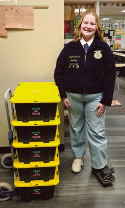Sophomore Braylea Lawson with Grow and Glow kits she designed as part of her joint project. Photo provided by Braylea Lawson