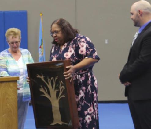 Mrs. Larman recieves senior class gift from Dawna Smith and Ryan Weathers