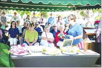 Nancy Knox of the Daughters of the American Revolution Samuel King Chapter participates in the wreath laying ceremony during the Memorial Day ceremony at Summit View Cemetery in Guthrie. Photo by Brent Fuchs