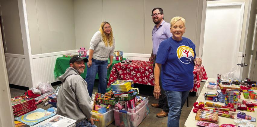 United Way of Logan County volunteers with wrapping presents for Wings of Hope in Guthrie. The nonprofit is one of 11 United Way partner agencies in Logan County. Photo Logan County United Way