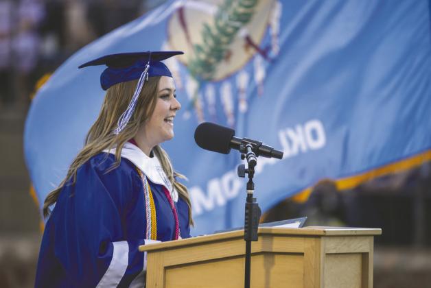Student body president Kyla Huskey addresses graduates and their families during Guthrie High School’s commencement ceremony Friday evening. Photo by Brent Fuchs.