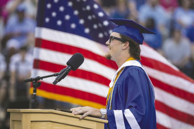Valedictorian Jace Rainwater shares words of encouragement and reflection with fellow graduates during Friday’s ceremony. Photo by Brent Fuchs.