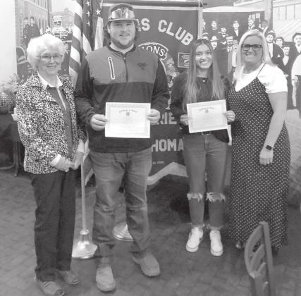 Pictured are Lions Past President Sylvia Ochs, Conner, Bella, and GHS Counselor Annie Chad.
