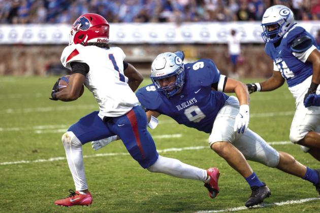 Senior Kellen Hirzel goes in for a tackle against the Bears’ Andre Blake.