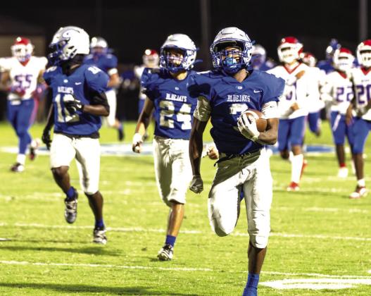 Guthrie’s Amare Watson breaks away for an 86 yard return during Friday’s homecoming game.