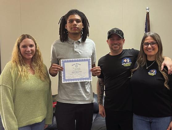 Pictured with Aiden is Rotarian Brittany Timmons and Jimmy and Kiesha Johnson with Chef Jimmy’s Baked Goods.