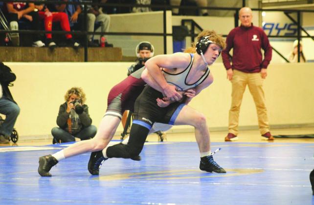 Guthrie's Aydin Smith fights with Perry's Carson Avery in a dual between the two schools, Thursday, Dec. 5.