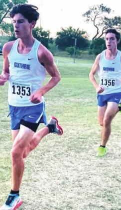 Mason Mayer runs in the OBU XC Challenge October 7 with teammate Lance Sallee in pursuit