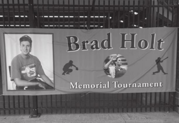 Brad Holt pictured on a banner outside Squires Field in Guthrie