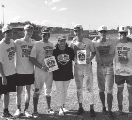 Members of the 2021 Brad Holt Memorial Tournament Champion Oklahoma Dirt Bags pose with Becky Holt. The Dirt Bags went 3-0 with a run differential of plus 26.