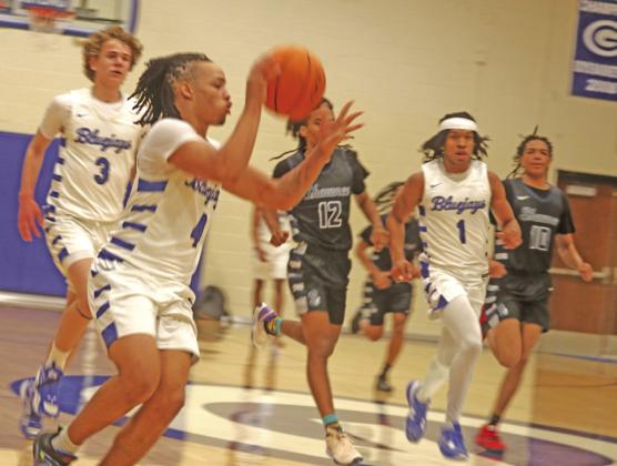 Jaylen Harper, Kolson, Smedley and Nate Benford on the break against Shawnee Feb. 23.