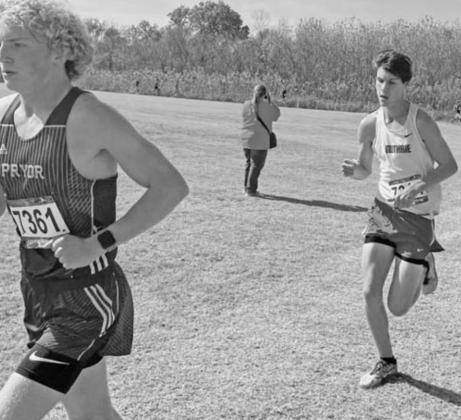 Mason Mayer chases down race leader Mason Pendley of Pryor High School