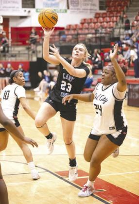 Aiden Hardiman (5) of Guthrie elevates for a shot between two Classen SAS defenders during a Class 5A state regional game Feb. 27, 2026, at Midwest City High School. Photo by Brent Fuchs