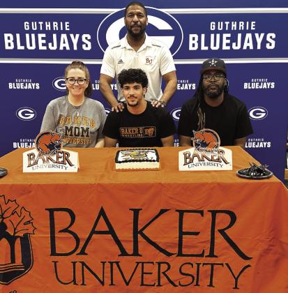 Guthrie senior wrestler Robert Brown signed a Letter of Intent with Baker University on April 29. Photo by Mike Monahan
