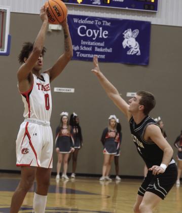 Crescent’s Kade Varner gets his three point shot off against Oilton on January 18.