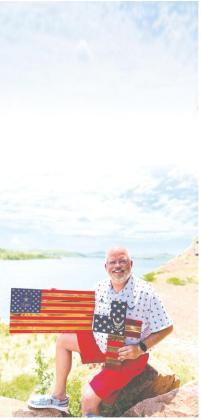 Kris Morgan with display of his flags.