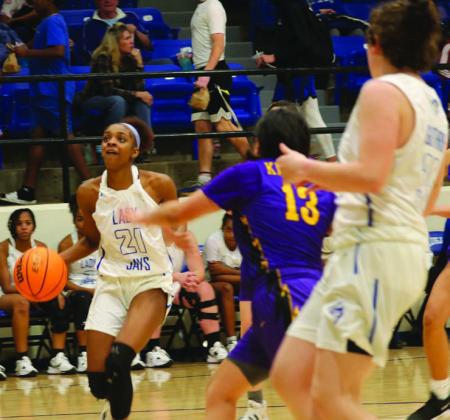Ania Morgan drives to the basket as Denise Doolitle looks to help.