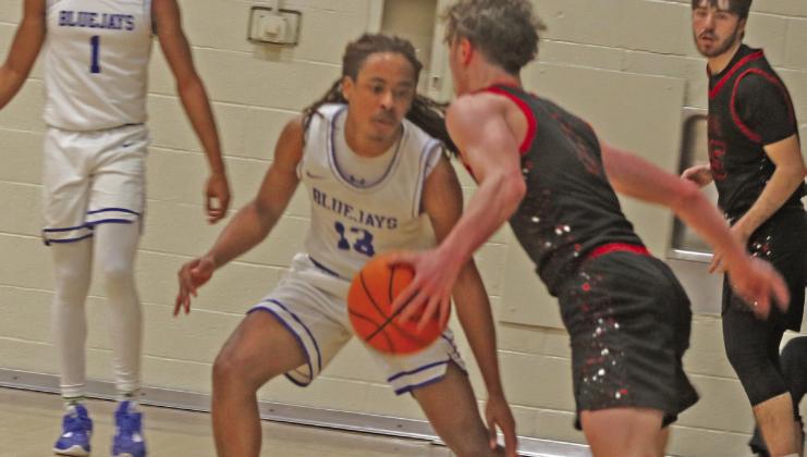 Guthrie Boys Basketball-Braydon Morgan looks to steal ball from Elgin.