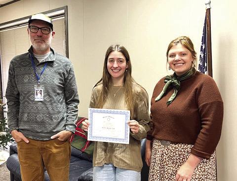 Pictured with Cora is Tourism Director, Justin Fortney and Rotary President, Coy McPeek. Photo submitted