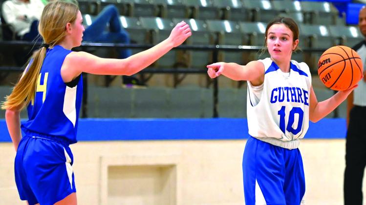 GJHS 8th Grader Emalyn Redman brings ball up the court in Dec.8 game against Noble. Photos by Brett Tennyson.