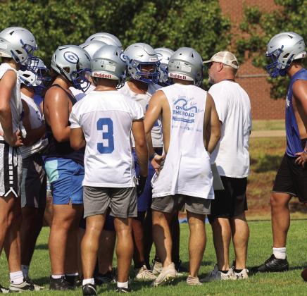 Bluejays Head Coach Kelly Beeby talks to his defense o first day of practice.