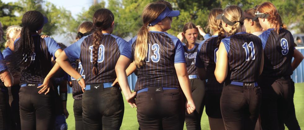 Lady Bluejays get words of wisdom from Coach Kara Tarrant after win.
